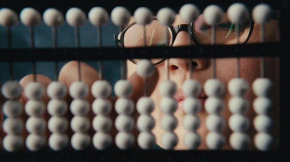 A photograph showing the white beads of the abacus that is used in the Abacus Bee.